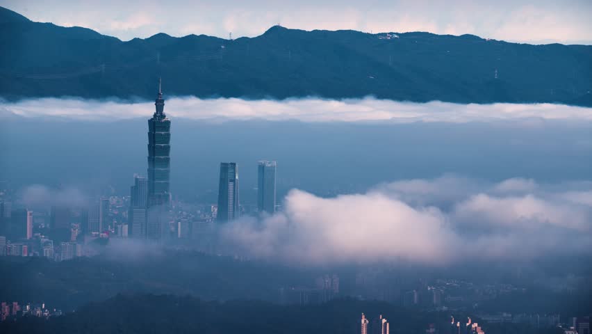 A serene spring morning view of Taipei from Lion Head Mountain. White clouds drift over the city skyline, featuring prominent high-rise buildings.
