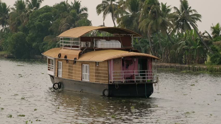Traditional kerala houseboat sailing in backwaters, India