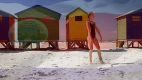 Doing cartwheel on sandy beach, child near colorful beach huts and animation. coastline, summer, vacation, childhood, movement, playfulness - Powered by Shutterstock - Get 15% off with code: PIKWIZARD15