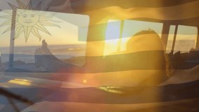 Uruguay flag with sun symbol overlaying sunset view from car window. travel, patriotism, journey, landscape, scenic - Powered by Shutterstock - Get 15% off with code: PIKWIZARD15