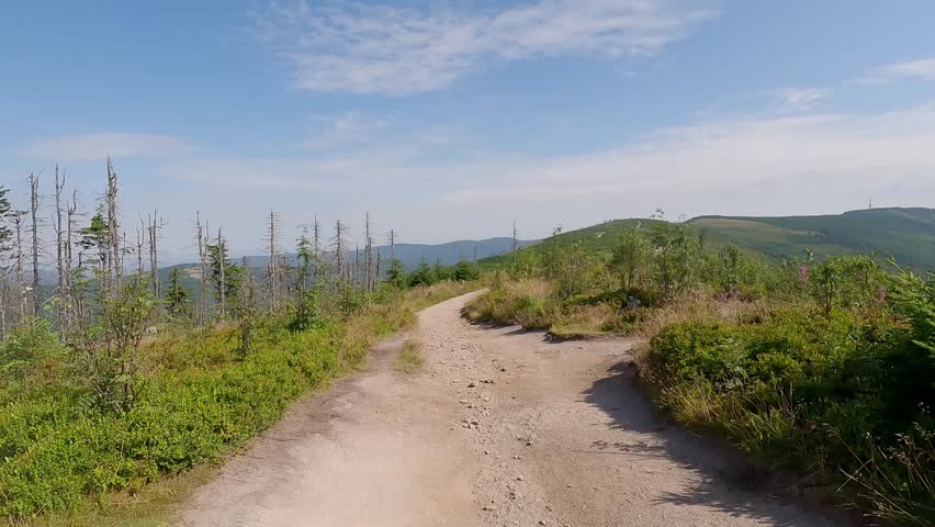 Hiking trail with beautiful view on Malinowska Skala hill in Beskid Slaski mountains in Poland during summer