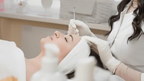 A skilled cosmetologist is performing a detailed cosmetic procedure on a clients face using specialized tools in a serene spalike environment that promotes relaxation and wellness - Powered by Shutterstock - Get 15% off with code: PIKWIZARD15