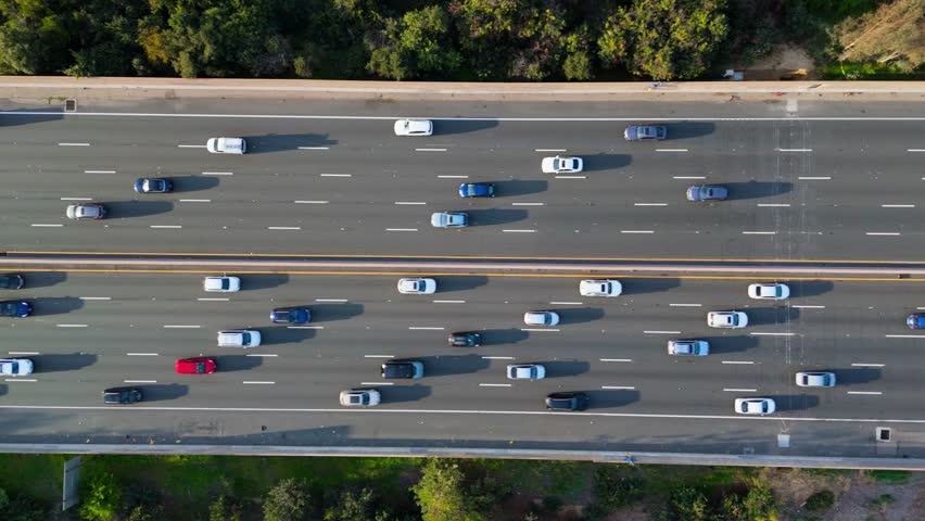Aerial View of Busy Freeway Traffic, Lateral Drone Movement