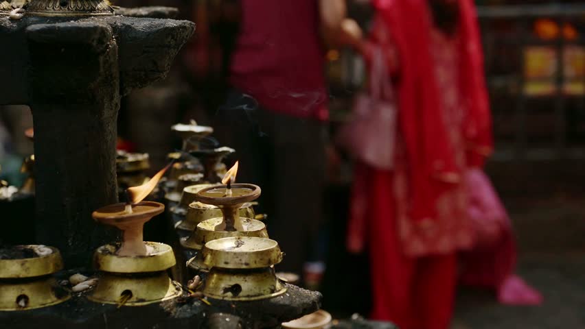 Candles and Hindu People Praying at a Religious Ceremony, Hindu Religion People in Prayer at a Hindu Religious Temple in Kathmandu in Nepal, Close Up of a Religious Festival and Praying Rituals