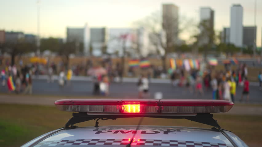Red police flashing lights close up on patrol car. Ensuring safety and security public event. Warning auto siren closeup, urban city street. Emergency service ready to prevent crime. People protection