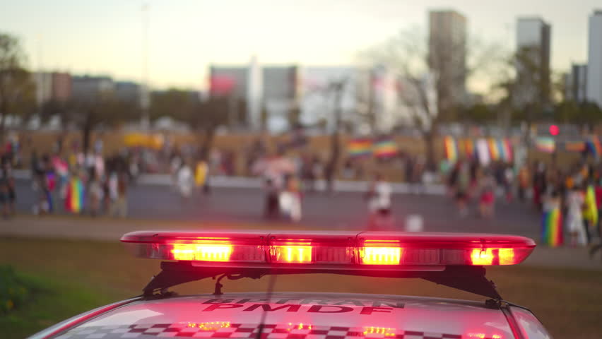 Red police flashing lights close up on patrol car. Ensuring safety and security public event. Warning auto siren closeup, urban city street. Emergency service ready to prevent crime. People protection