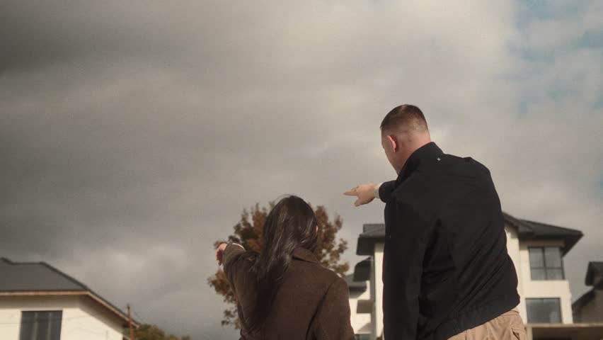 Young successful family choose a large country house to buy 