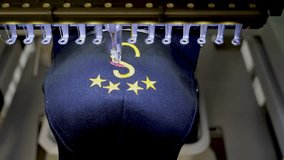 Machine embroidery of stars on a black hat with yellow thread. Embroidered baseball cap close-up. 4k 50 fps video. - Powered by Shutterstock - Get 15% off with code: PIKWIZARD15