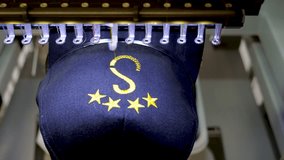 Machine embroidery of stars on a black hat with yellow thread. Embroidered baseball cap close-up. 4k 50 fps video. - Powered by Shutterstock - Get 15% off with code: PIKWIZARD15