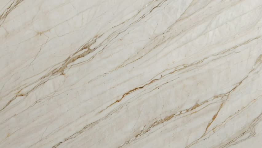 marble texture with a soft creamy white background, decorated with thin flowing veins of gold and brown.