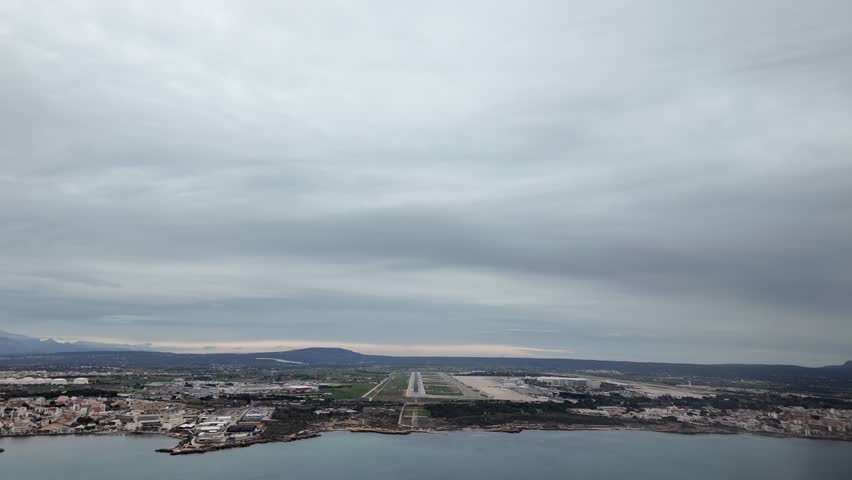 An Immersive view through the pilot’s eyes of a real time approach to Palma de Mallorca Airport in a cloudy day. 4K