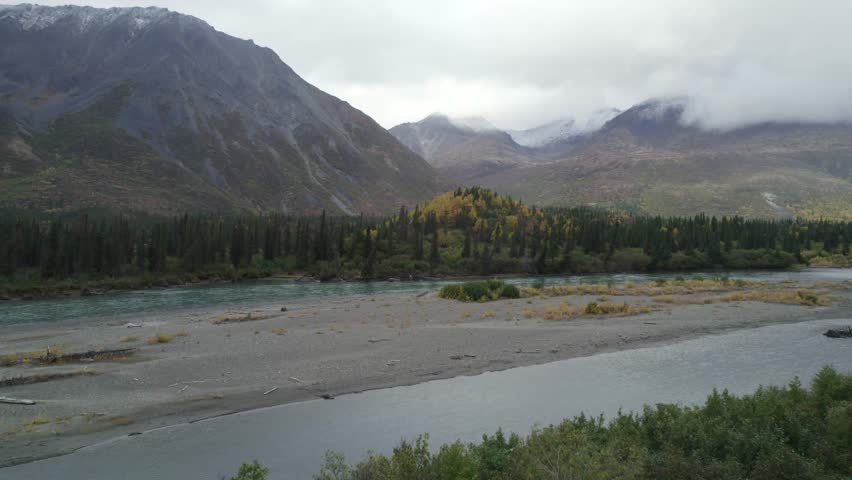 Majestic Alaska landscape with mountain river and forest, aerial view
