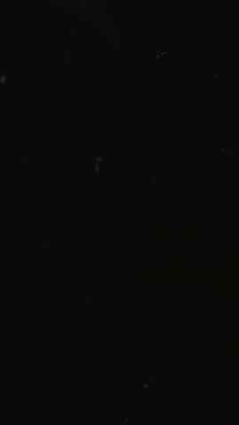 Realistic Snow Falling Animation on a Dark Background. Blurry Snow. 4K