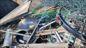 Zoom in of a Stock of scrap metal dump on a waste disposal site for recycling. Selective waste sorting and civil environmental responsibility concept. 4K video, slow motion - Powered by Shutterstock - Get 15% off with code: PIKWIZARD15