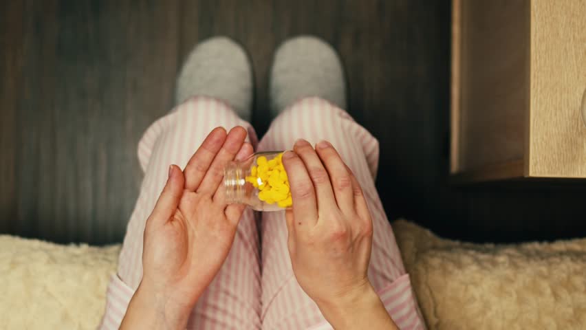 Pills and vitamins macro, Close up view of womans hands holding plenty of different drugs. Painkillers and antibiotics. Healthcare and medicine concept