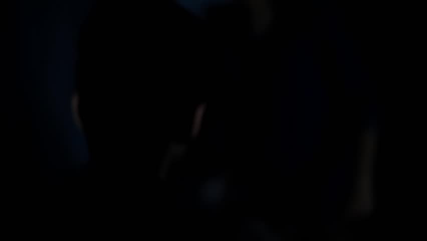 Cinematic HD footage of a masked man interrogating and violently assaulting a restrained hostage under moody lighting – perfect for crime drama, psychological thriller, or intense suspense scenes