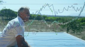 Elderly man sitting outdoors with stock market graph overlay animation. Stocks, finance, investment, technology, analysis, economy - Powered by Shutterstock - Get 15% off with code: PIKWIZARD15