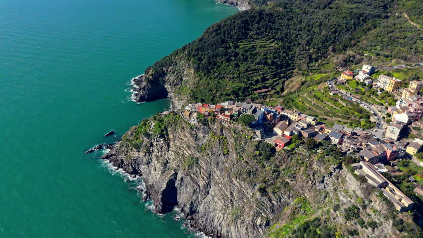 Picturesque view of Corniglia, Cinque Terre, Italy, with coastline and village