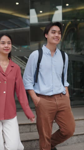 Young Asian tourist couple walking in Bangkok city center