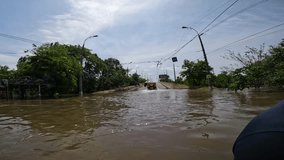 Flooding in Kherson town as a result of the explosion of a dam on the Dnipro river in city of Novaya Kakhovka. Consequences of the detonation of Kakhovka Hydroelectric Power Station. War in Ukraine - Powered by Shutterstock - Get 15% off with code: PIKWIZARD15