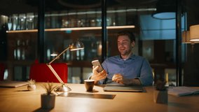 Businessman receiving message at night office feeling satisfied. Happy executive reading cellphone sms leaning on chair back in dark workplace. Smiling man employee enjoy phone salary notification. - Powered by Shutterstock - Get 15% off with code: PIKWIZARD15