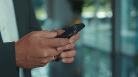 Young businessman hands write message on smartphone in corporate environment closeup. Crop hands of office manager texts on cellphone in workplace setting. Communication device - Powered by Shutterstock - Get 15% off with code: PIKWIZARD15