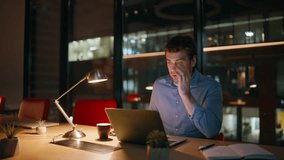 Overworked employee talking cellphone looking laptop screen at workspace late evening. Stressed manager finish phone call worried deadline. Overloaded businessman feeling tired of overtime night work. - Powered by Shutterstock - Get 15% off with code: PIKWIZARD15