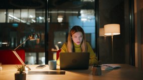 Overloaded executive looking solutions working late evening office. Unhappy businesswoman looking laptop screen at dark workplace. Tired woman programmer creating code at night. Overtime job concept. - Powered by Shutterstock - Get 15% off with code: PIKWIZARD15