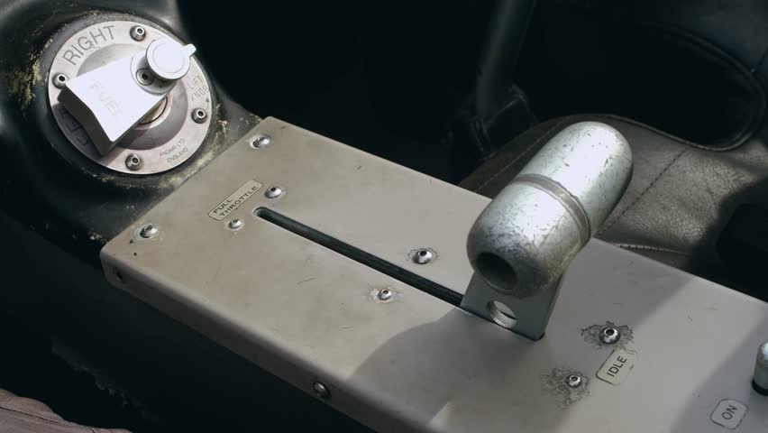 The hand of the pilot of a small training aircraft grabs the engine control lever and sets the maximum speed during takeoff. Close-up of the throttle inside the cockpit