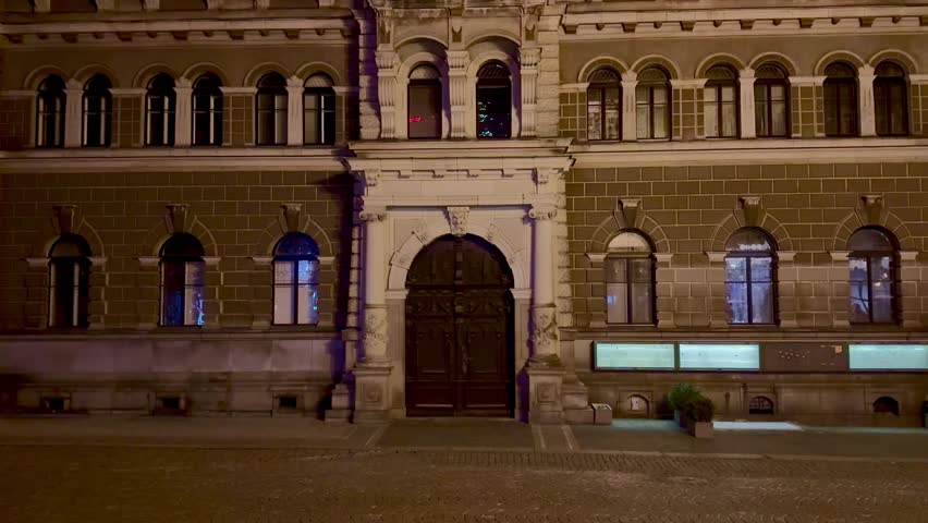 A stunningly illuminated historic building that showcases elegant classic architecture and features a grand entrance