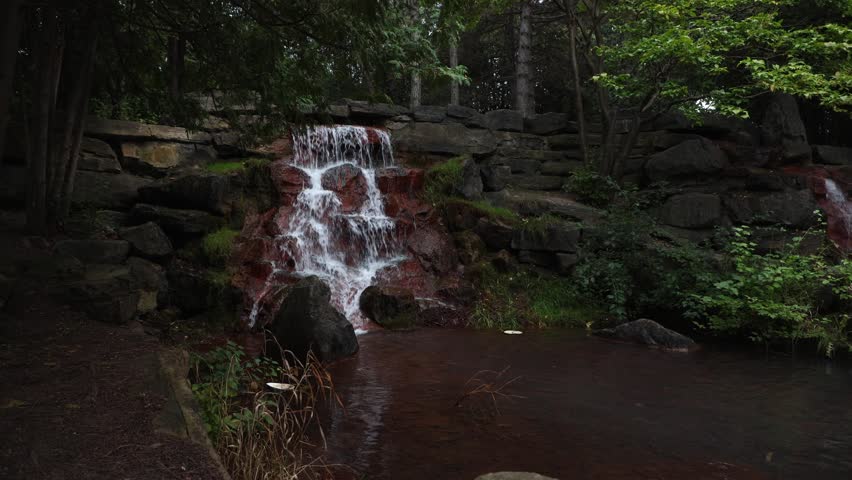 Waterfall in the park in summer. Keeley Falls in Andrew Haydon Park in Ottawa, Canada