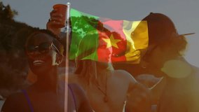Cameroon flag animation waving over people relaxing on sunny day at beach. relaxation, vacation, patriotism, travel, tourism, seaside - Powered by Shutterstock - Get 15% off with code: PIKWIZARD15