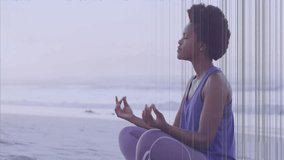 Meditating on beach, person with colorful animation lines overlaying scene. Meditation, mindfulness, relaxation, tranquility, harmony, spirituality - Powered by Shutterstock - Get 15% off with code: PIKWIZARD15