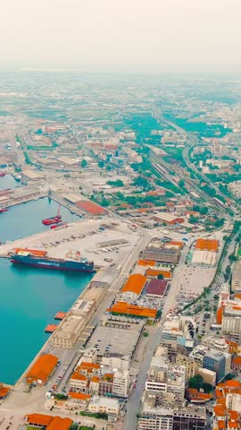 Vertical video. Thessaloniki, Greece. Panorama of the central part of the city. Summer, Aerial View, Departure of the camera. Rich colors