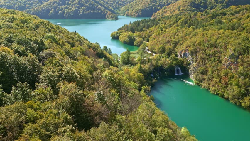 Beauty nature with waterfall. Panoramic aerial view of waterfalls. Beauty green nature. Plitvice lakes and Waterfall. Beauty waterfall landscape in Croatia. Summer view of Plitvice lakes.