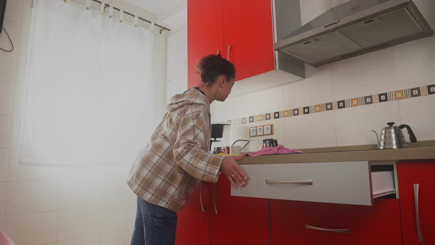 Parent and Child Cooking Together in a Modern Kitchen