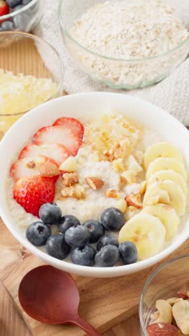 Healthy Oatmeal Breakfast – Topped with Fruits, Nuts, and Comb Honey