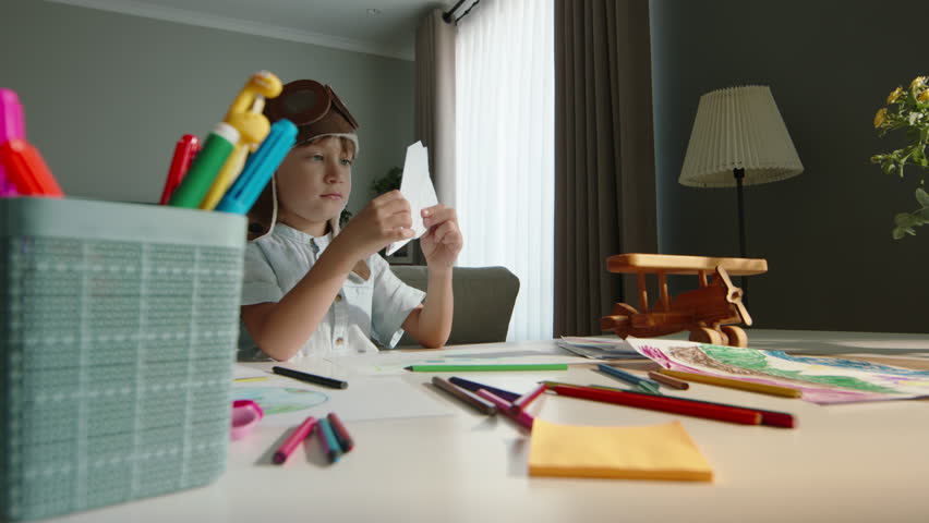 Concentrated little boy in pilot