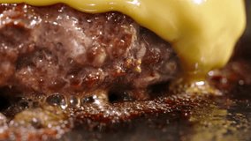 Macro shot of frying beef halal cutlets with melted cheese on top. Cinematic advertisement burger cooking. Making cheese burger, traditional cooking. Halal beef cutlets being fried to perfection - Powered by Shutterstock - Get 15% off with code: PIKWIZARD15