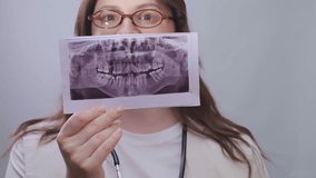 By comparing the patient's X-rays, the dentist analyzes changes and selects the best treatment strategy. - Powered by Shutterstock - Get 15% off with code: PIKWIZARD15