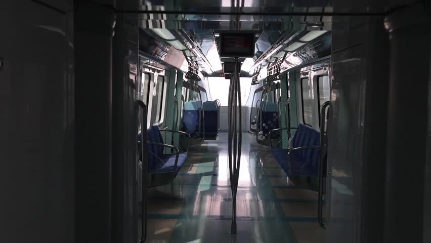 A Captivating View Inside an Empty Subway Car Moving Train, Capturing the Unique Atmosphere and Sense of Solitude Amidst the Urban Journey, Inviting Reflection on the Experience of Commuting