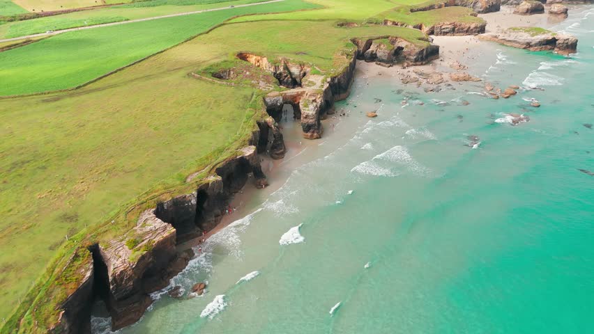 Amazing aerial view of the Playa de Las Catedrales beach in Galicia region, northern Spain. Beautiful cliff formations on famous Cathedral Beach, Cantabrian Coast 