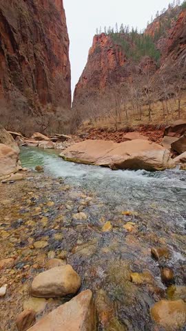Water flowing between the rocks and mountains 