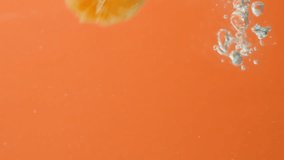 Peeled fruit tangerines in water, lots of bubbles, slow motion. - Powered by Shutterstock - Get 15% off with code: PIKWIZARD15