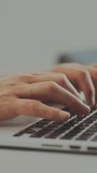 Slow-motion shot of a freelance worker sitting at desk, working from home and typing on laptop - Powered by Shutterstock - Get 15% off with code: PIKWIZARD15