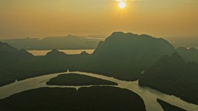Aerial drone view of heart shape Island of Love in mangrove forest 
beautiful green mangrove forest sea water. 
stunning sunrise view over heart island. archipelago and mangrove forest background - Powered by Shutterstock - Get 15% off with code: PIKWIZARD15