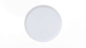 Close-up Effervescent tablet aspirin, vitamins on a white background. Macro shot of fine air bubbles in water in a petri dish. The medicine concept, health care, treatment. Slow motion. - Powered by Shutterstock - Get 15% off with code: PIKWIZARD15