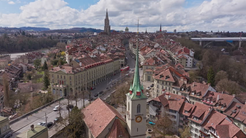 Panoramic aerial view of Bern, Switzerland, featuring the old town, the Aare river and the Nydeggbrucke bridge and Nydeggkirche