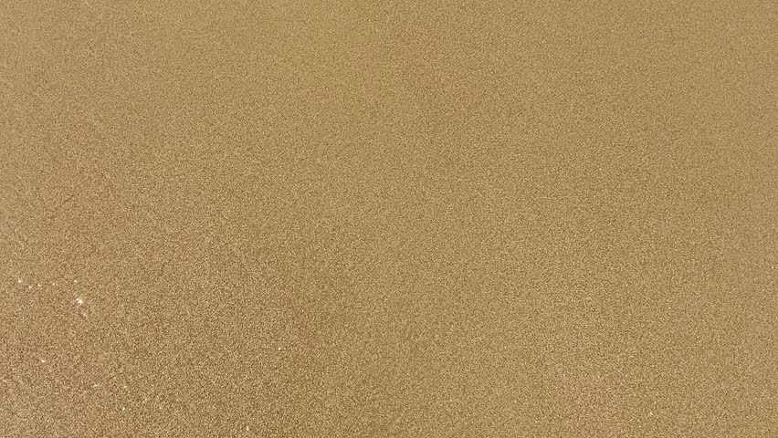 Picturesque beach, waves crashing on the sandy shore. Sea waves beat against the rocks. Cyprus Island, Mediterranean Sea.