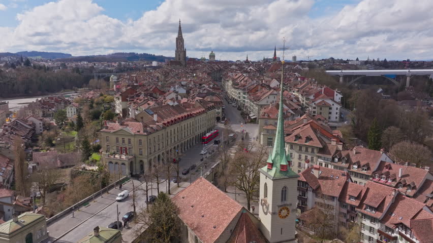 Aerial view of Bern, Switzerland, highlighting the historic Nydegg Church, Nydeggbrucke and its surrounding cityscape